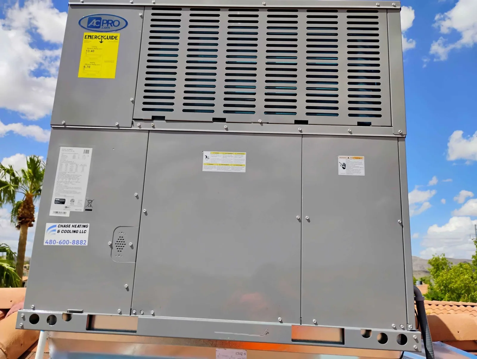 New rooftop package unit on a tile roof