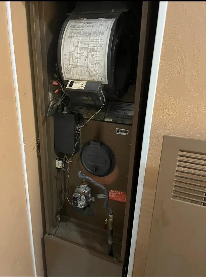 Furnace with the blower compartment open for service