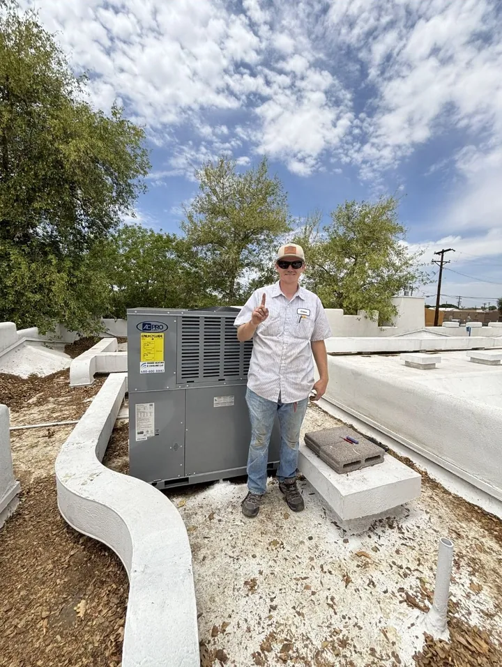 New condenser on its pad at a finished install