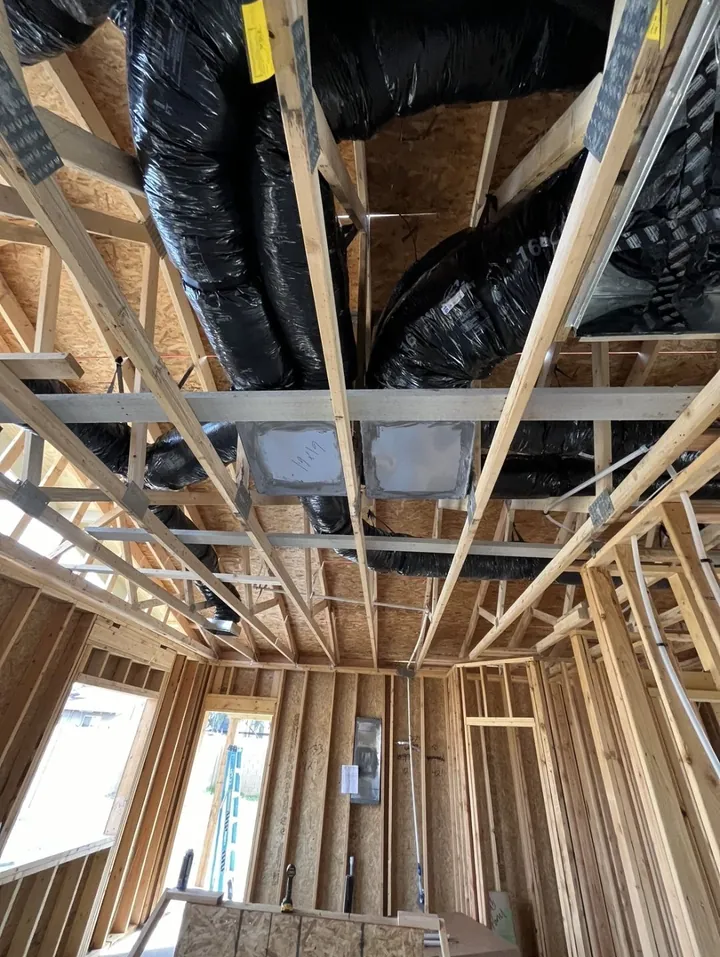Flex duct run through the framing of a new build