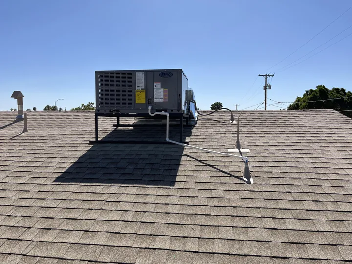 Rooftop package unit set on a shingle roof