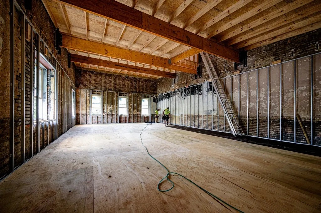 Open rafters and exposed wall framing during a renovation